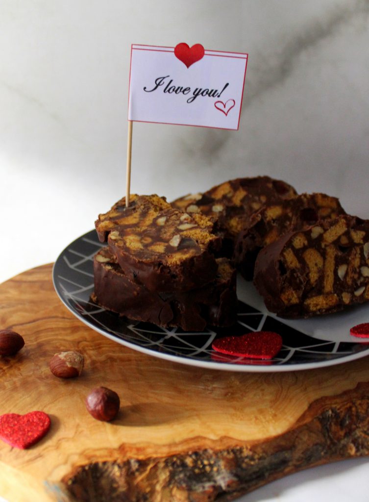 Slices of Vegan No-Bake Chocolate Salami with a sign that says 