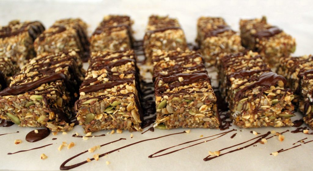 Healthy vegan no-bake protein bars covered with chocolate