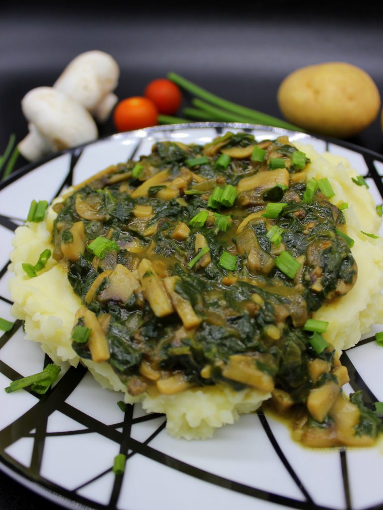 Vegan mashed potatoes with mushroom and spinach gravy