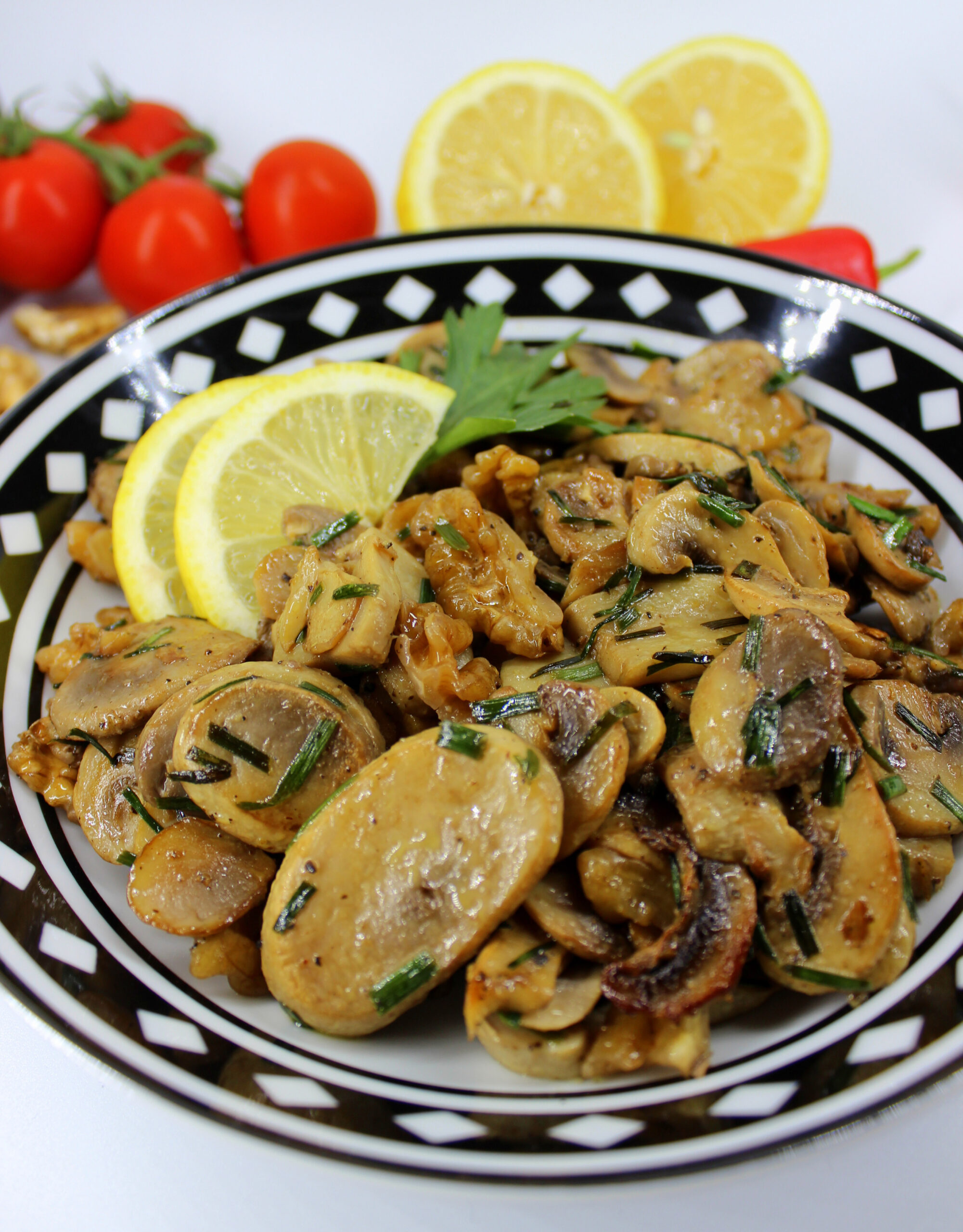 Plate of mushrooms with lemon and walnuts