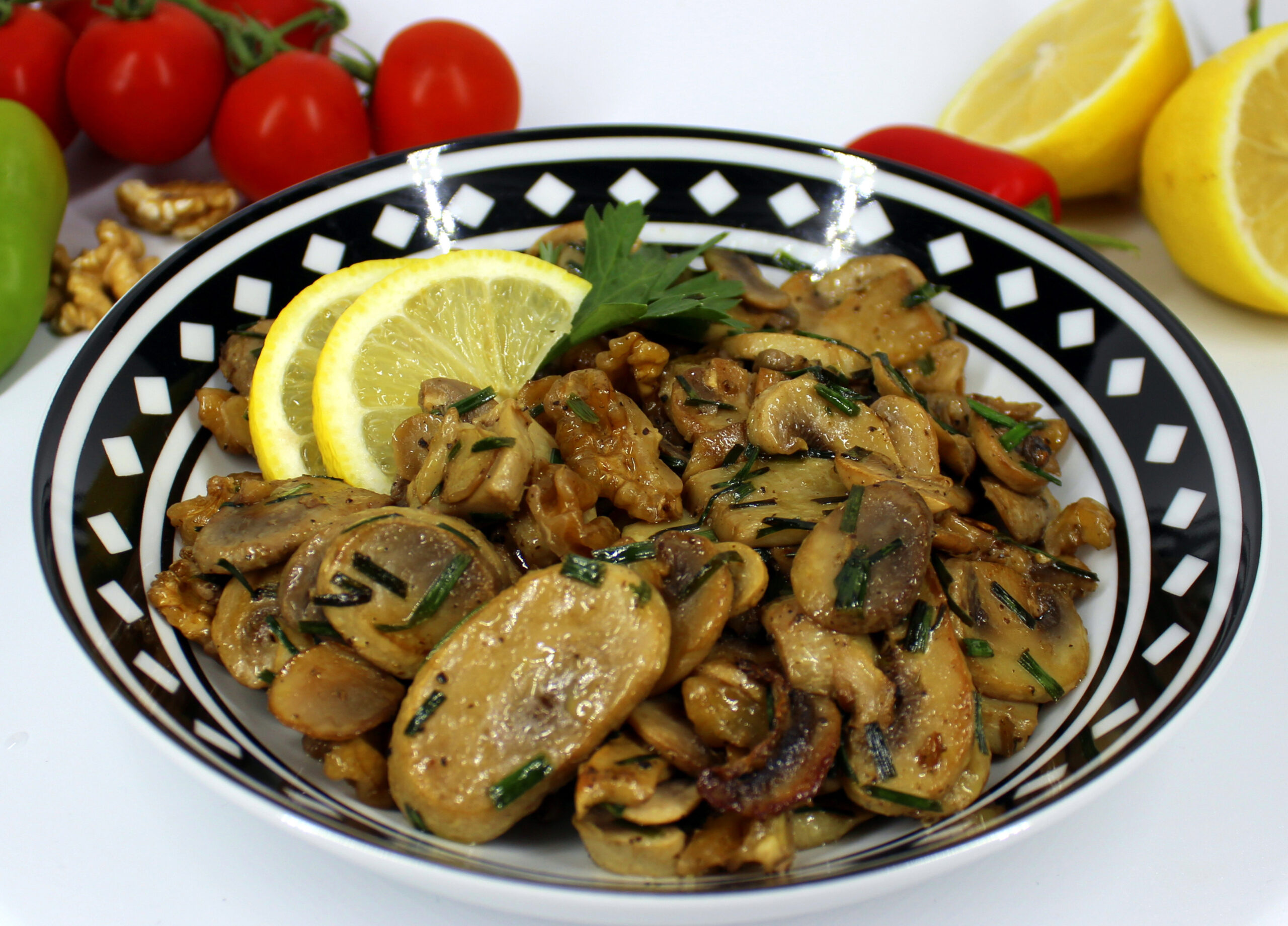 Plate of mushrooms with lemon and walnuts